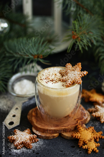 Gingerbread snowflake cookie, a cup of cappuccino for christmas.