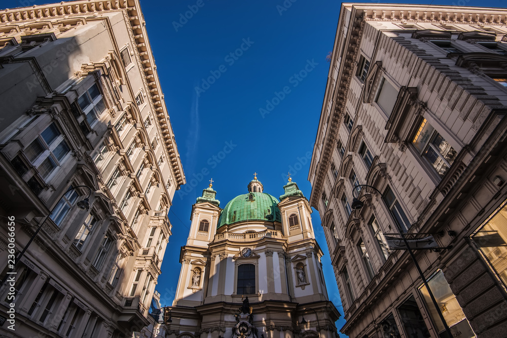 Vienna, Austria - December 24, 2017. St. Peter's Church or Peterskirche is famous Baroque church and popular viennese landmark. Roman Catholic parish church with dome and chapels by sunny day.
