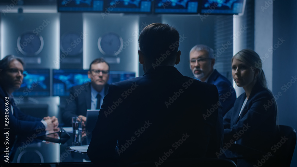Chief Strategy Officer Making Report to a Board of Directors During Annual Financial Meeting in the conference Room. Business People / Politicians / Government Officials on a Meeting. Chief Strategy Officer Making Report to a Board of Directors During Annual Financial Meeting in the conference Room. Business People / Politicians / Government Officials on a Meeting.