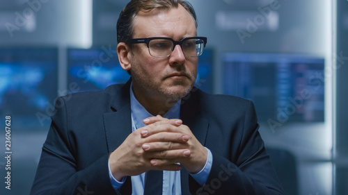 Portrait Shot of Chairman of the Board of Directors Making a Speech For His Business Partners and Gives Orders to His Subordinates on the Weekly Meeting. Politician Talks with His Advisors photo