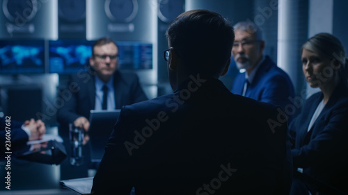 Chief Strategy Officer Making Report to a Board of Directors During Annual Financial Meeting in the conference Room. Business People / Politicians / Government Officials on a Meeting.