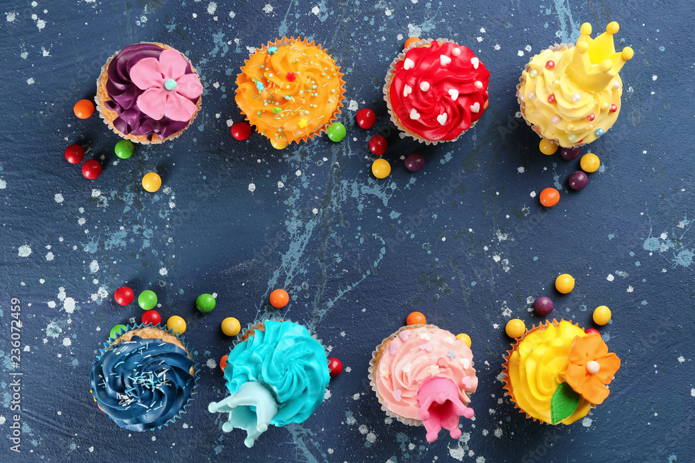 Tasty cupcakes on color background Tasty cupcakes on color background