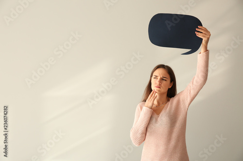 Thoughtful young woman with...