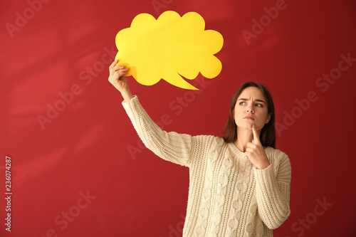 Young woman with blank spee...