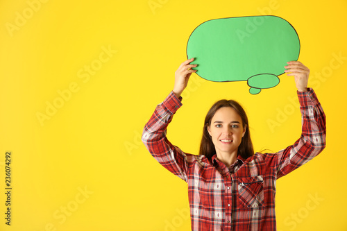 Young woman with blank spee...