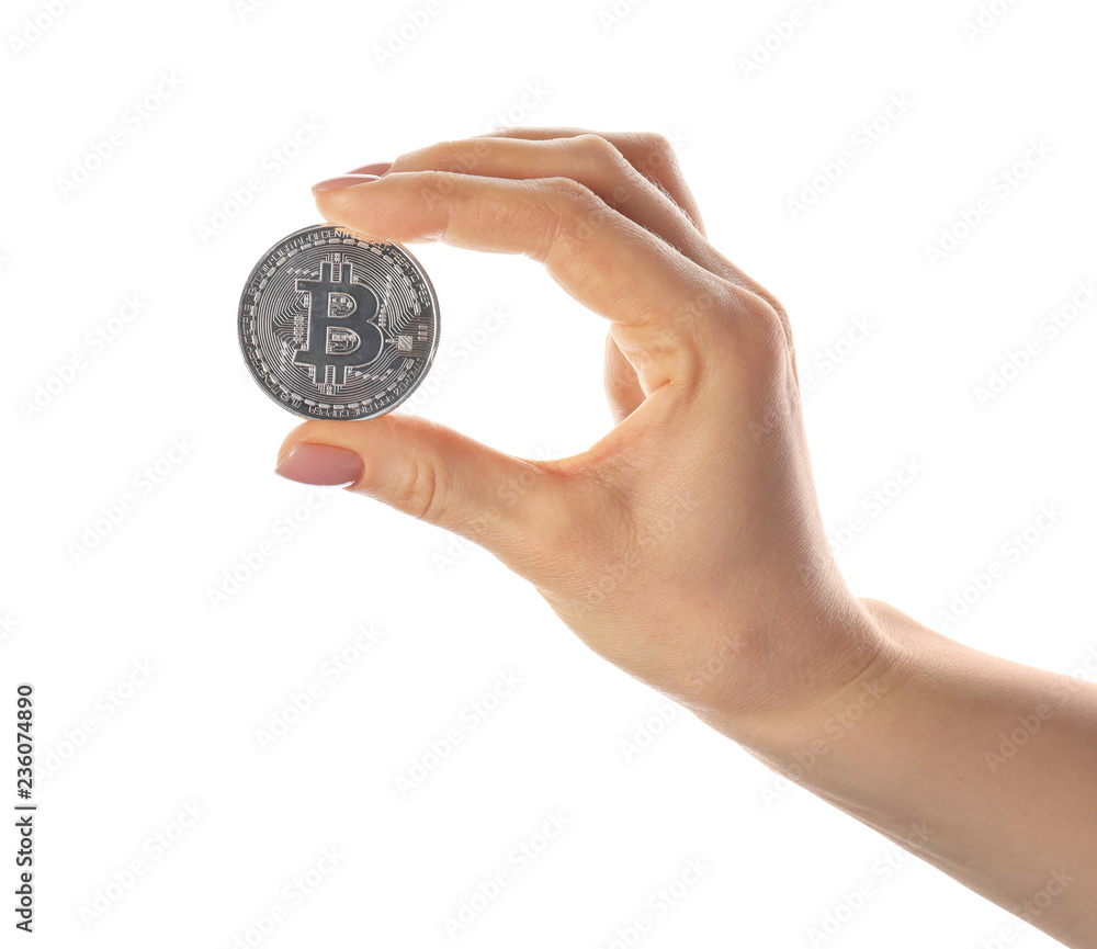 Female hand with bitcoin on white background Female hand with bitcoin on white background