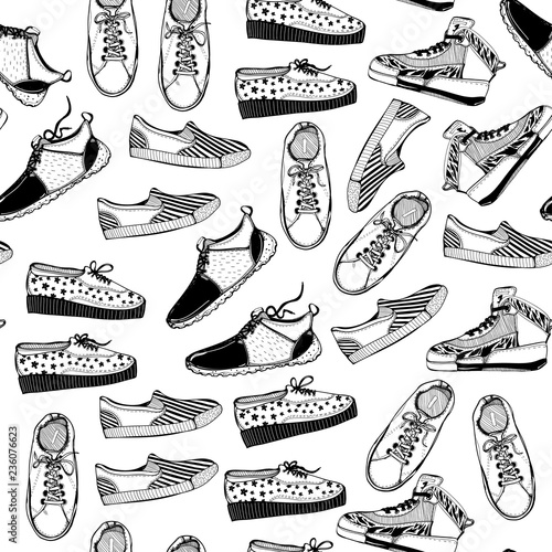 Various hand drawn sneakers. Graphic vector seamless pattern