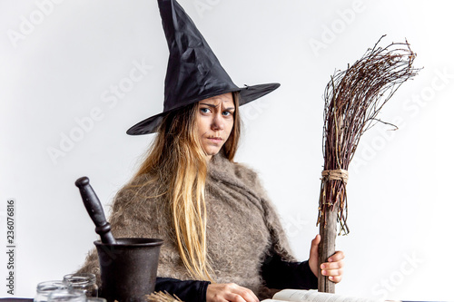 Fototapet A young woman wearing a witch costume