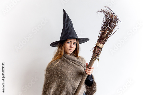 Obraz na plátně A young woman wearing a witch costume