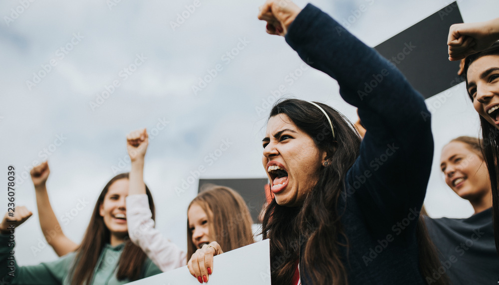 Group of angry female activists is protesting - obrazy, fototapety, plakaty 