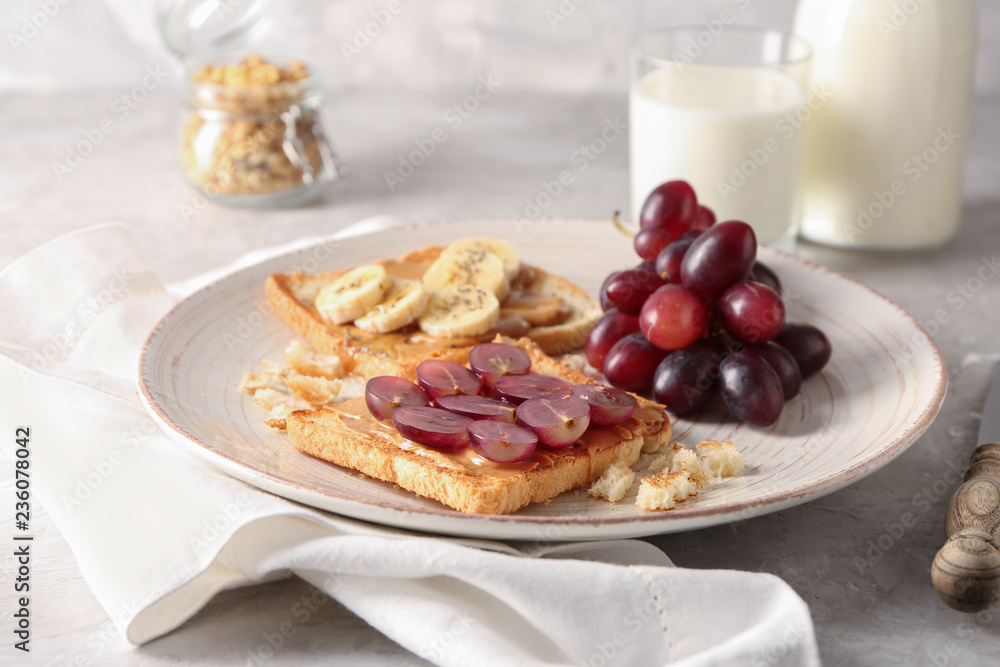 Plate with different delicious toasts on table Plate with different delicious toasts on table