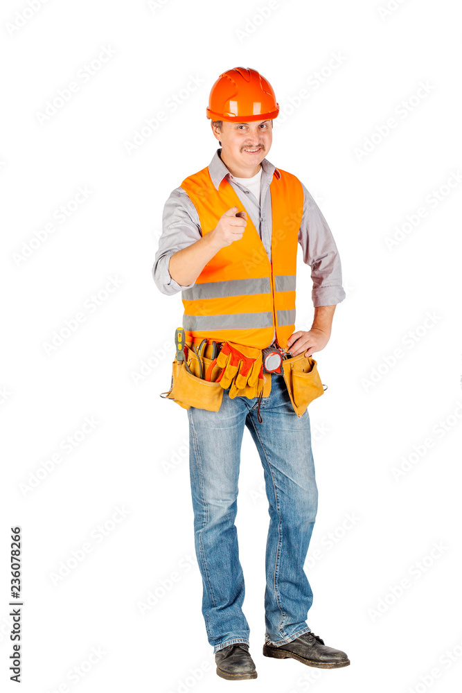 Portrait of a male builder in a helmet looking at camera over white wall background. repair, construction, building, people and maintenance concept. Portrait of a male builder in a helmet looking at camera over white wall background. repair, construction, building, people and maintenance concept.