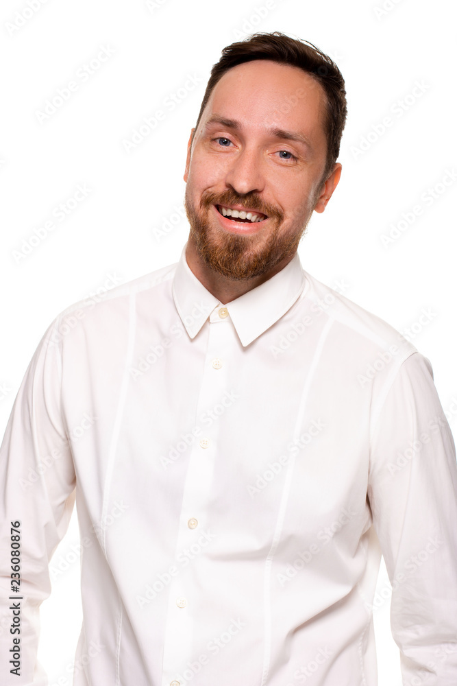 Stylish bearded business man smiling to camera, having pleased expression and cheerful look. Stylish bearded business man smiling to camera, having pleased expression and cheerful look.