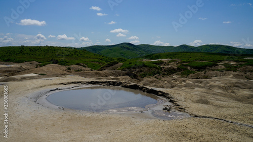 Landscape with an active mud volcano crater. Mud Volcanoes (Vulcanii Noroiosi) geological reservation, Buzau, Romania.