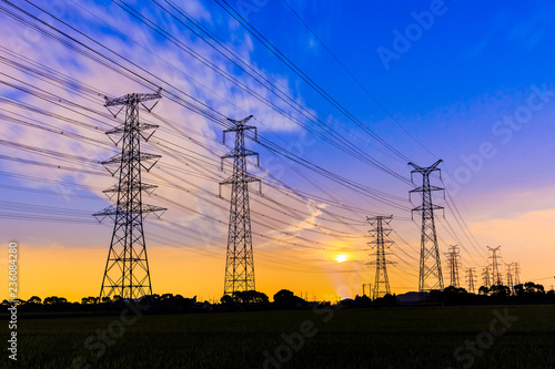 high-voltage power lines at sunset,high voltage electric transmission tower