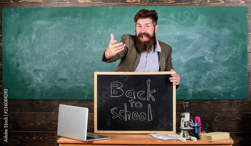 Celebrate day of knowledge. Teacher or educator welcomes inscription back to school. Teacher experienced educator welcomes new enrollees to begin study and get education. Welcome back to school photo