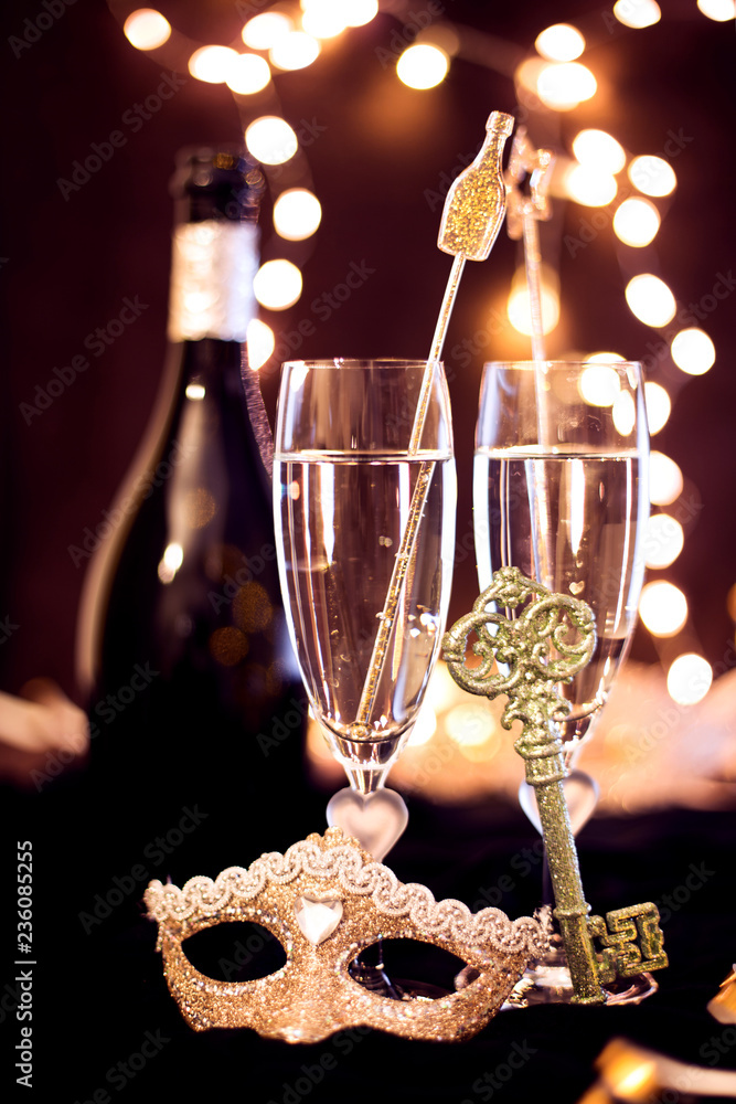 Sylwester, Andrzejki's toast for two. Champagne and fortune telling on a black background. Celebration, lights and new year