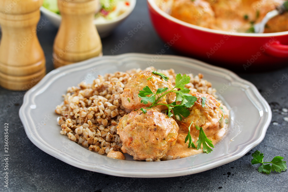 Meatballs in a creamy tomato sauce.