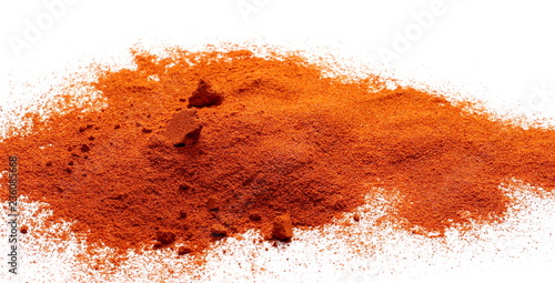Pile of red grounded pepper, paprika powder isolated on white background