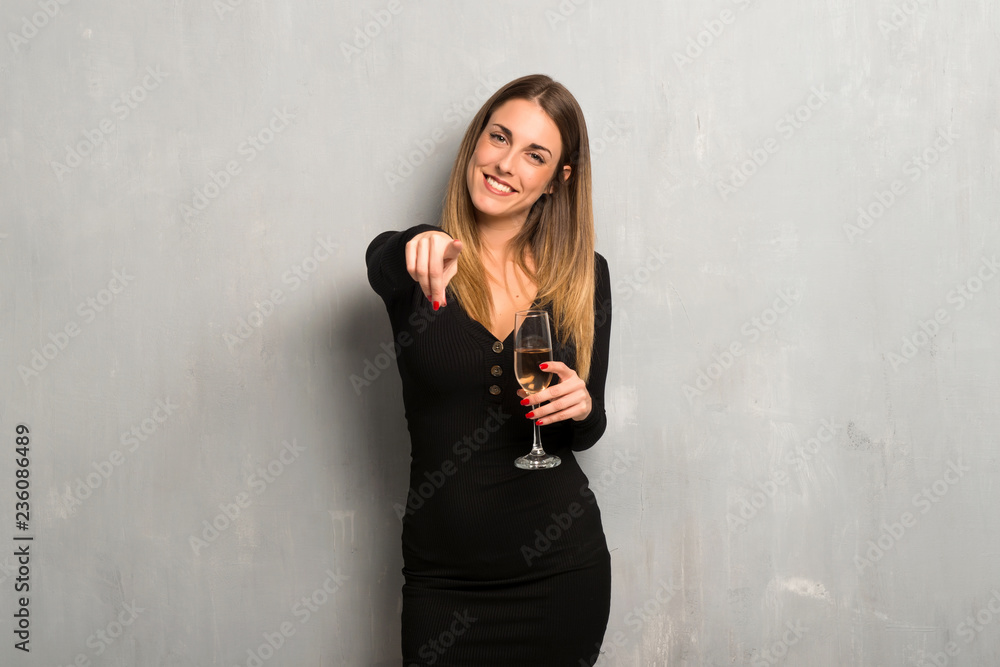 Woman with champagne celebrating new year 2019 points finger at you Woman with champagne celebrating new year 2019 points finger at you