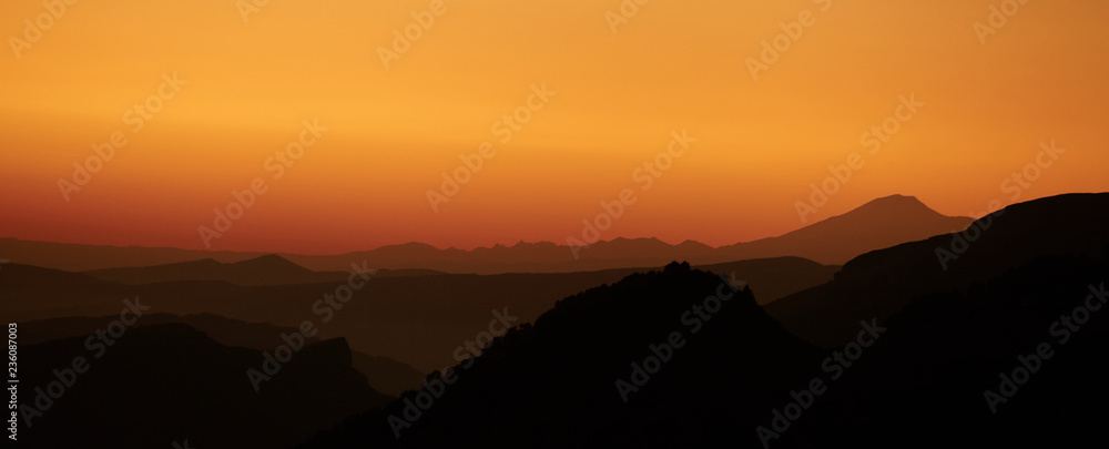 Landscape with mountains and the sun. Sunset. Mountain landscape. Abstract background