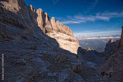 Mountaineers equipped face the "Bocchette Alte" ferrata in the Brenta group on the Dolomites, in Italy