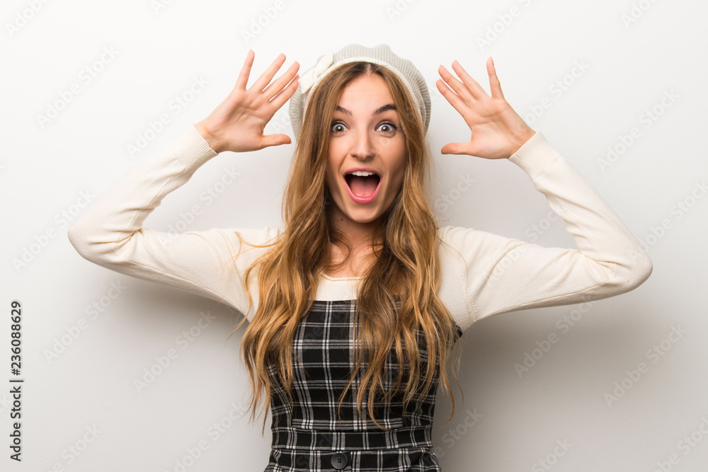 Fashionably woman wearing hat with surprise and shocked facial expression Fashionably woman wearing hat with surprise and shocked facial expression