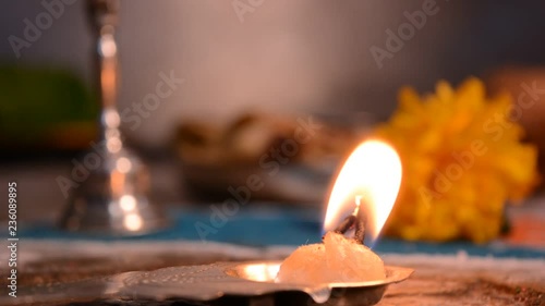 Aarti plate is a Hindu religious ritual of worship, a part of puja, in which light from wicks soaked in ghee (purified butter) or camphor is offered deities. photo