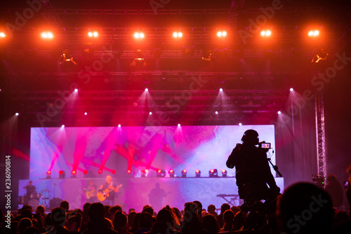 Silhouette of a crowd of cheering fans during a live concert