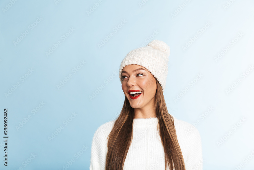 Pretty young woman wearing sweater and hat Pretty young woman wearing sweater and hat