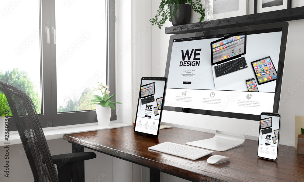 black and white desktop with three devices showing app designers website black and white desktop with three devices showing app designers website