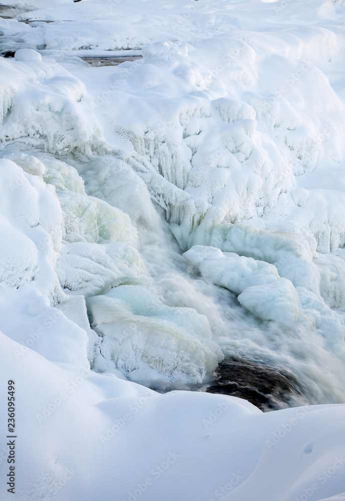 frozen waterfall Tannforsen in winter, Sweden
