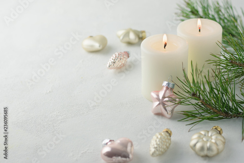 Christmas toys, fir branch and candles