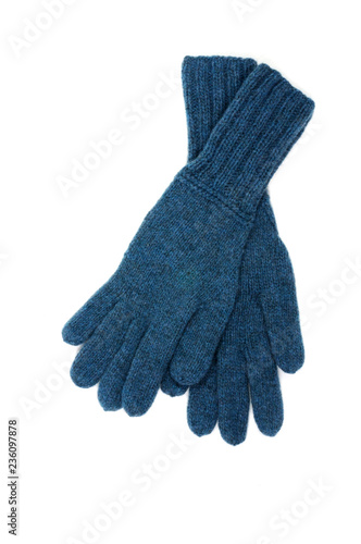 Blue knitted gloves isolated on white background. Handwork. View from above.