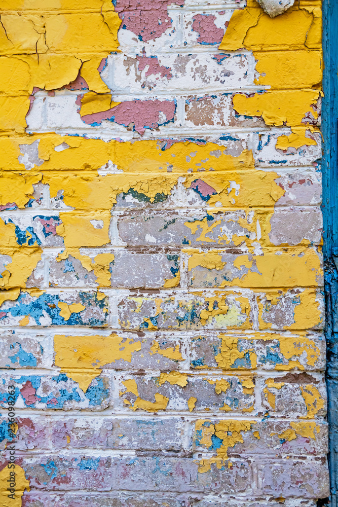 Cracked wall with old layers of paint in abandoned house Cracked wall with old layers of paint in abandoned house