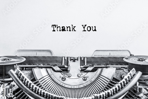 Thank you. The text is typed on a vintage typewriter on a white background. Close-up.