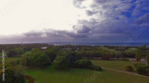 Aerial shot from Hammars park of Oresundsbron with Sibbarps camping and a cloudy sky in 4k. photo