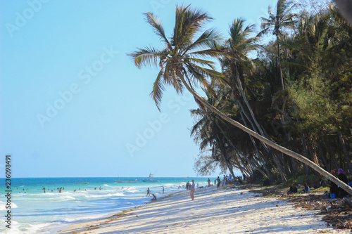 Fotografie Mombasa, Kenya - December 21, 2015: Diani Beach Indian Ocean Beach - palm trees,