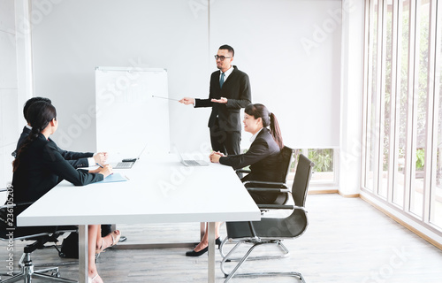 Business men and women look good at a financial meeting at work.