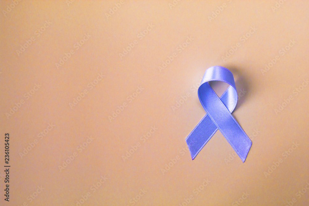 Blue ribbon prostate cancer symbol on pastel background. Awareness and healthcare concept.  Copy space. - obrazy, fototapety, plakaty 
