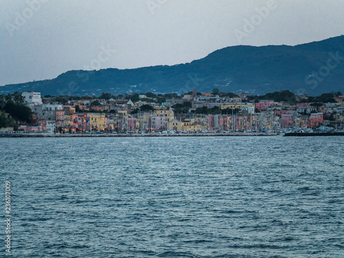 Italy, Campania, Gulf of Naples, Naples, Procida Island with colorful houses in the morning and Marina di Sancio Cattolico
