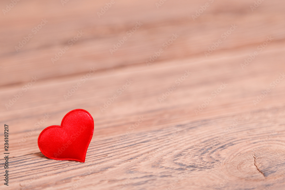 Valentine's day red heart on wooden background. Holidays background. Love card. Selective focus Valentine's day red heart on wooden background. Holidays background. Love card. Selective focus