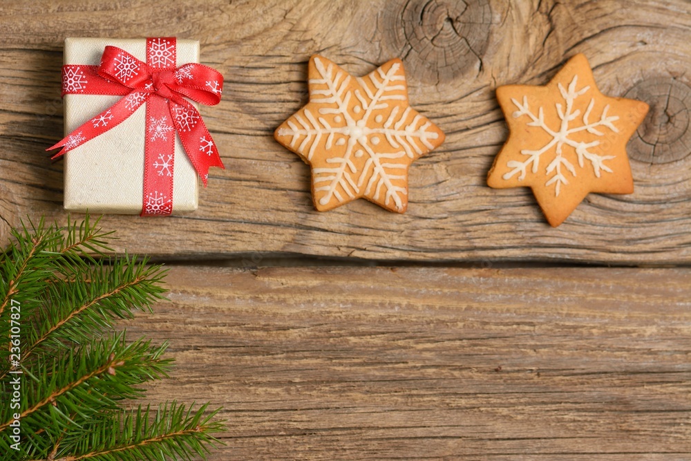 Christmas greeting card with gingerbread cookies and xmas gift box Christmas greeting card with gingerbread cookies and xmas gift box
