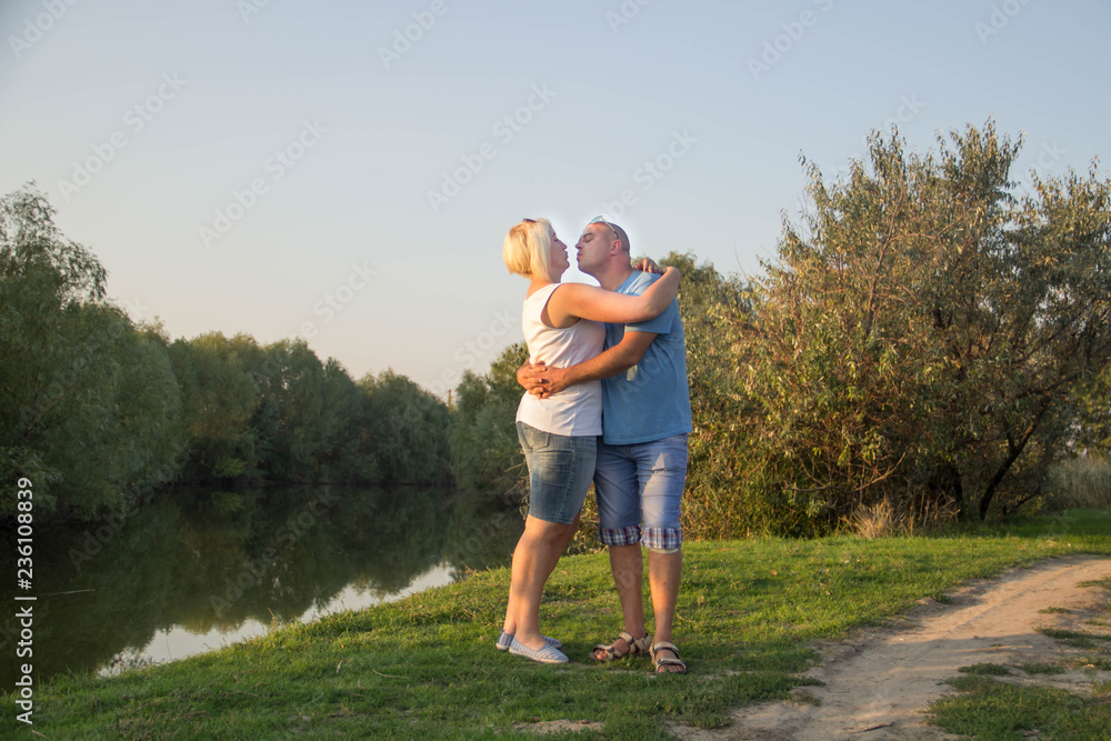 Couple in love hugging at sunset Couple in love hugging at sunset