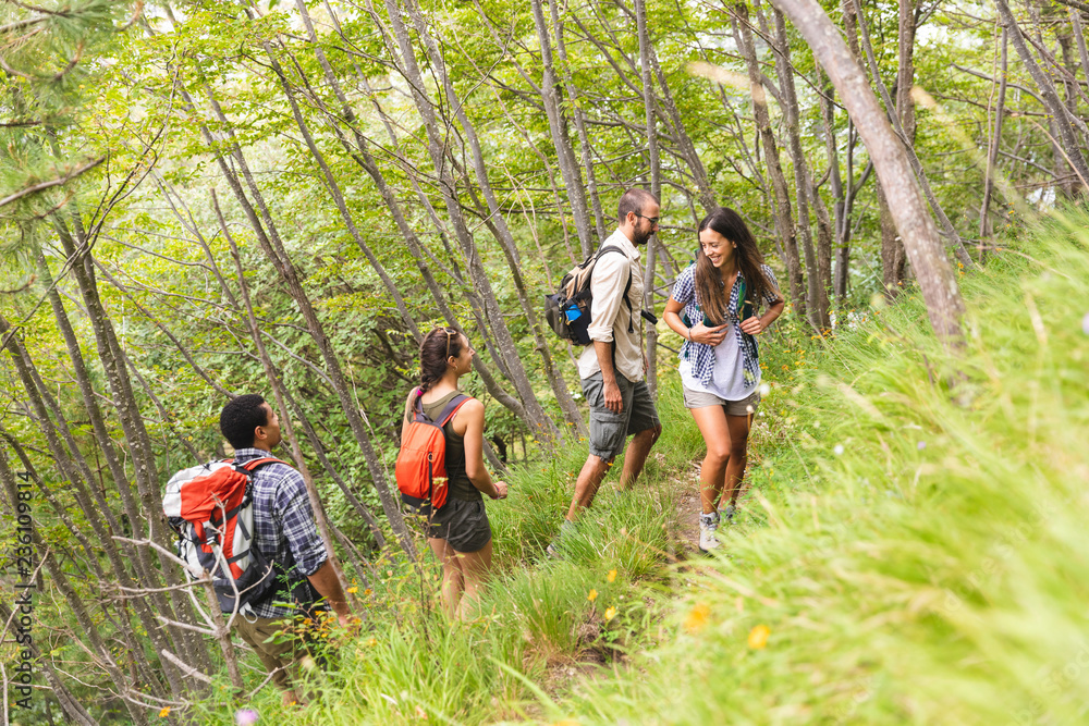 Italy, Massa, group of young people hiking in the Alpi Apuane mountains Italy, Massa, group of young people hiking in the Alpi Apuane mountains