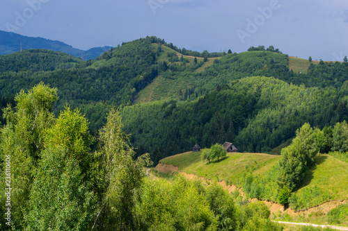 Mountain landscape with paths and sky cloudy