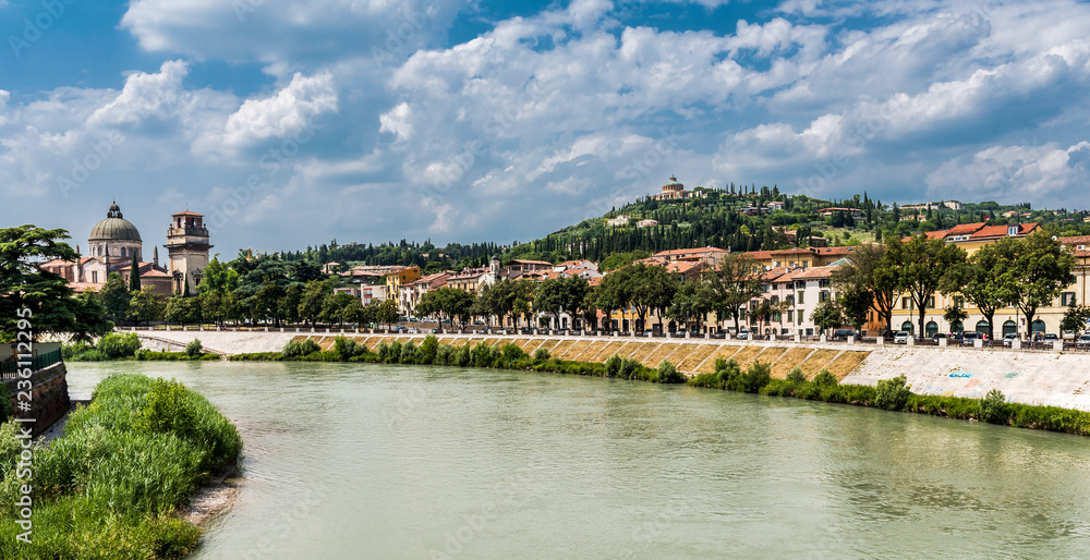 Verona in Italy and the River Adige. In the distance you can see the hill of St Peter and the famous roman theatre