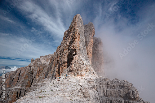 Fototapete Mountaineers equipped face the Bocchette Alte ferrata in the Brenta group on t