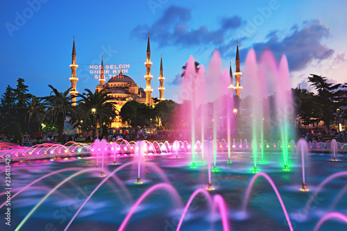 Blue Mosque with the fountain in the foreground, famous tourist destination in Istanbul, Turkey, on the first day of Ramadan with illuminated message which means "Welcome the sultan of eleven months".