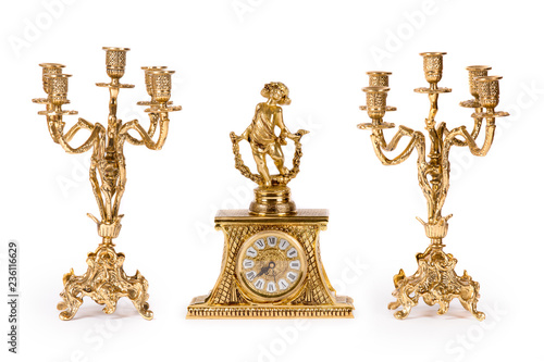 Vintage gold watch with candelabra on white background